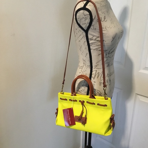 Dooney & Bourke Handbags - Dooney & Bourke yellow Purse. NWT